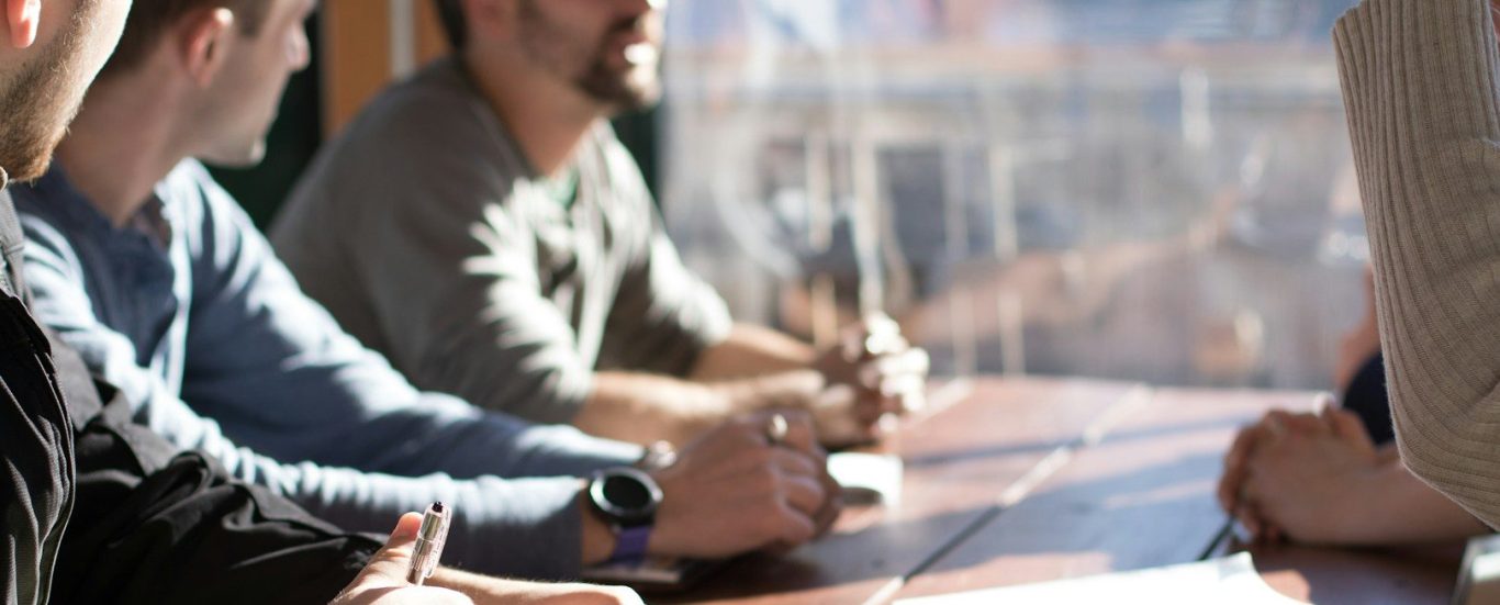 Team of professionals in discussion – SourceArc Semi consulting on semiconductor sourcing and procurement strategies.