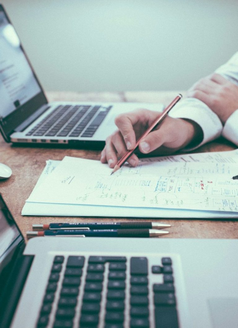 Professional reviewing data and forecasts – SourceArc Semi consulting on semiconductor supply chain management and procurement.